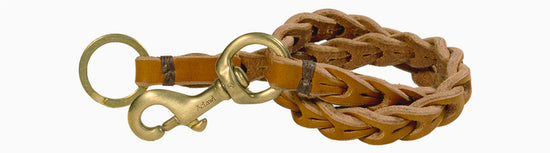 handcrafted braided chain / vegetable tanned bullhide leather with natural edge / signature solid brass snap hook / solid brass split ring / hand sewed with waxed linen thread / crafted in Italy